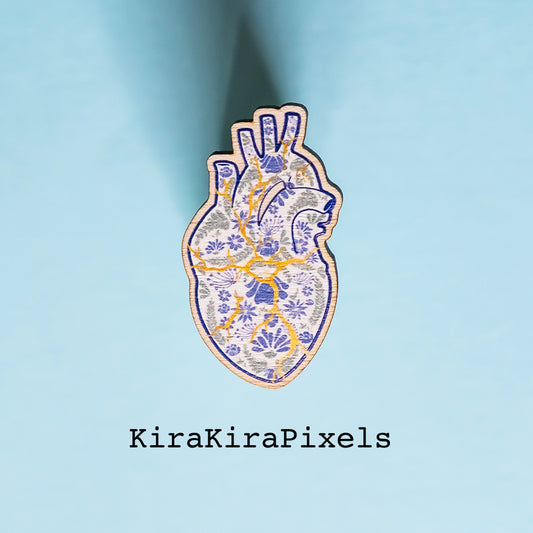 Kintsugi Corazon. Mending a broken heart with gold. The heart's detailed is meant to represent Mexican embroidery. Japanese and Mexican inspired art. Wooden Pin