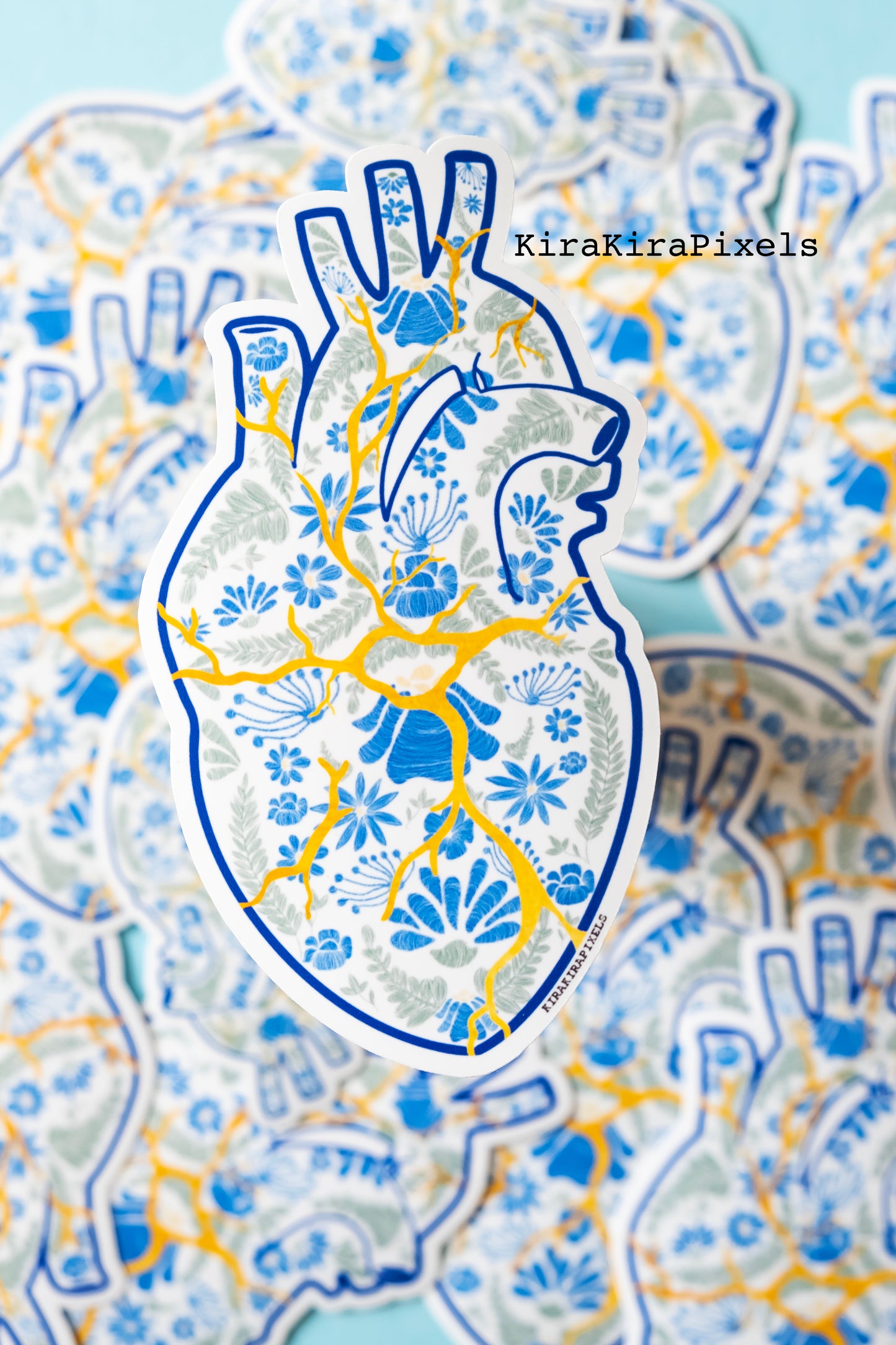 Kintsugi Corazon. Mending a broken heart with gold. The heart's detailed is meant to represent Mexican embroidery. Japanese and Mexican inspired art. Vinyl Sticker