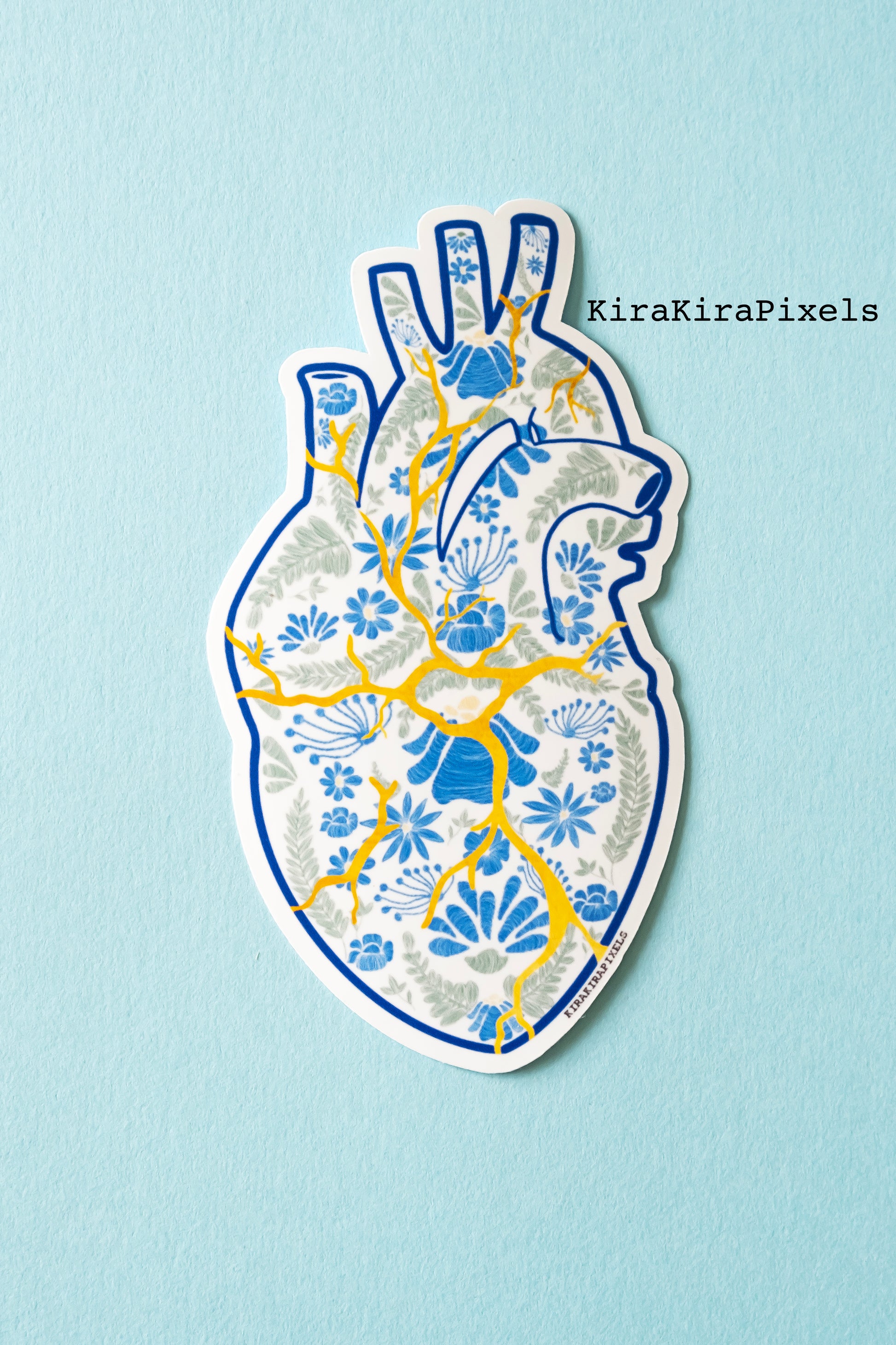 Kintsugi Corazon. Mending a broken heart with gold. The heart's detailed is meant to represent Mexican embroidery. Japanese and Mexican inspired art. Vinyl Sticker